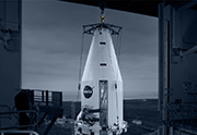 Rocket payload lifted by crane